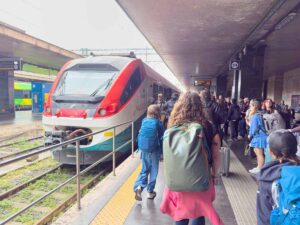 Celine Brewer, owner of 55StillAlive.com, walks to her train at the Roma Termini.